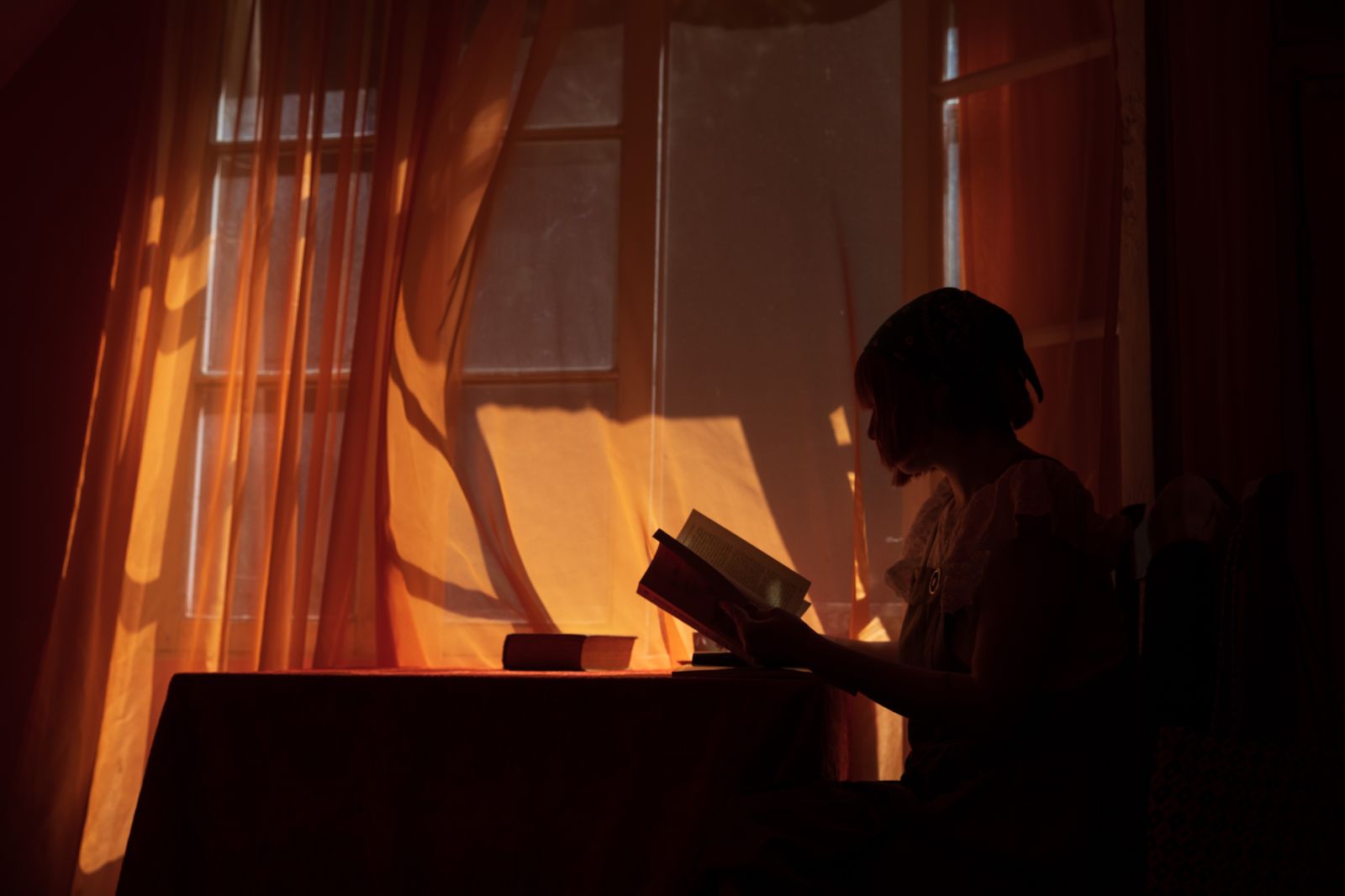 A family silhouette in dim light