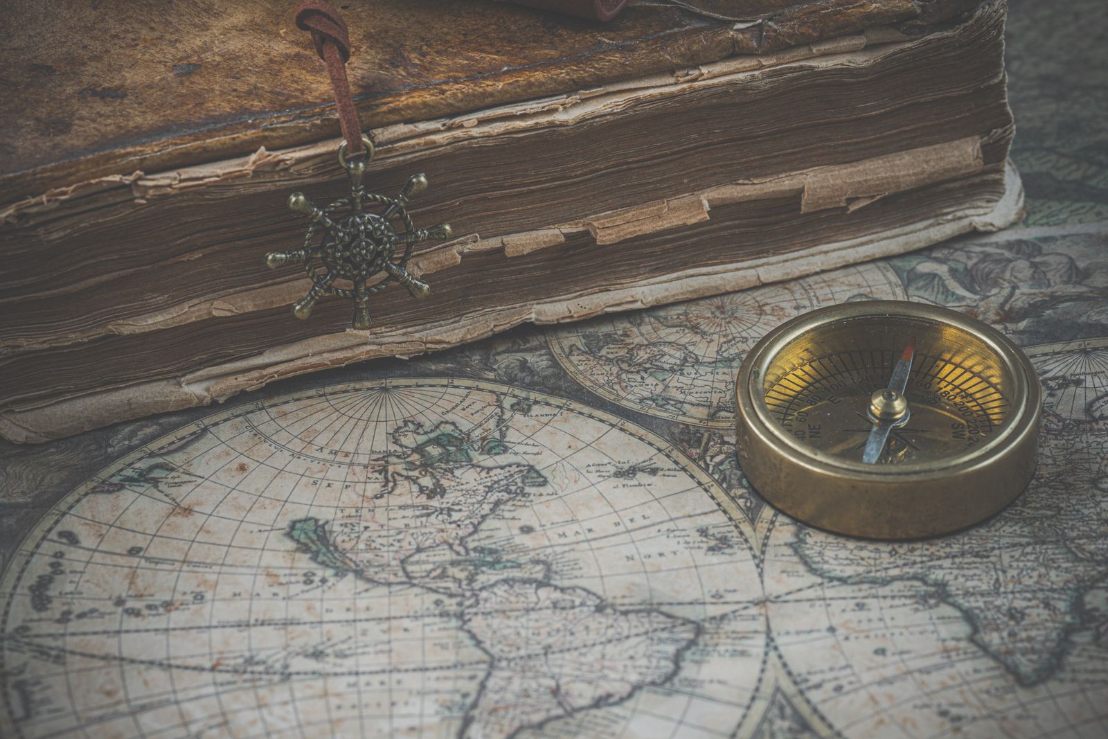 An antique map with a compass