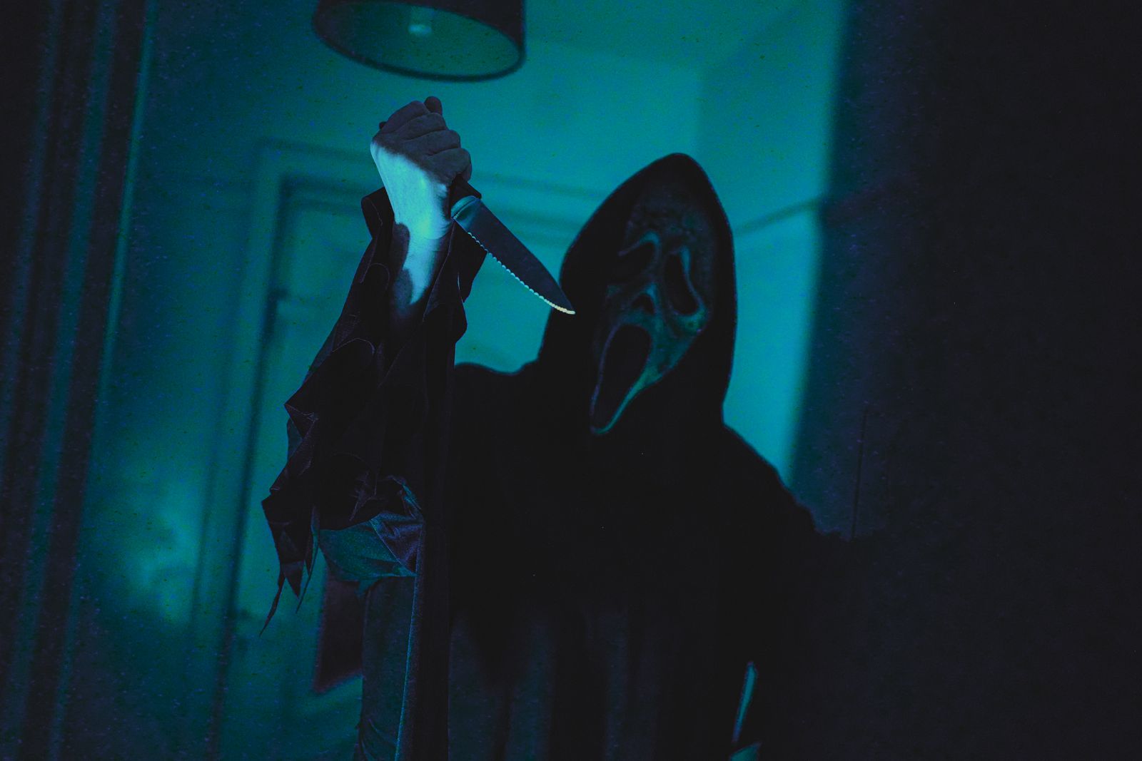 A stranger at a dark doorway