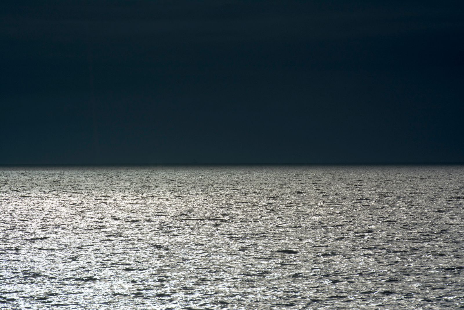 A silver blade in dark water